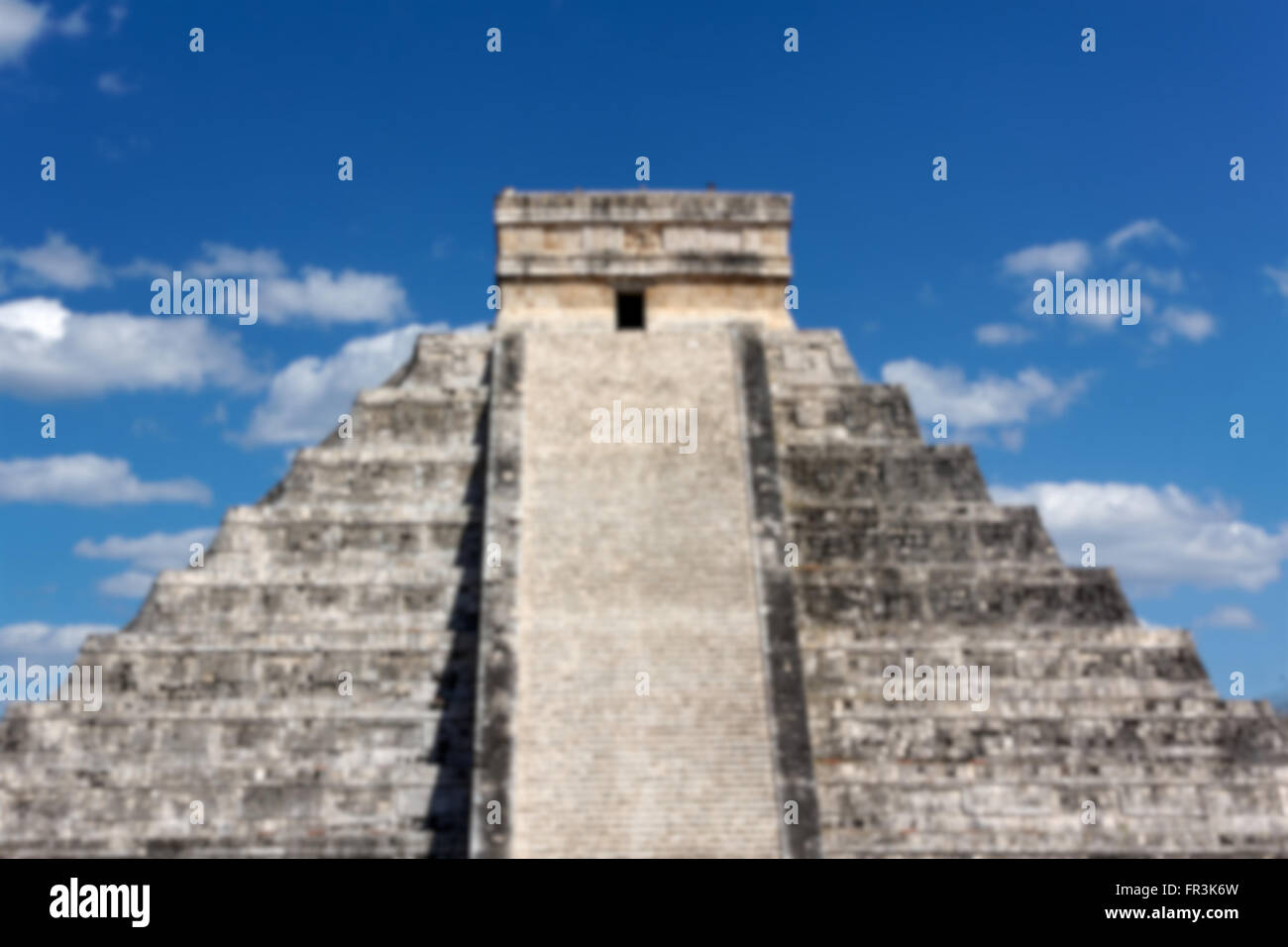Blurred background of Mayan temple Pyramid at Chichen Itza, Yucatan, Mexico. Stock Photo