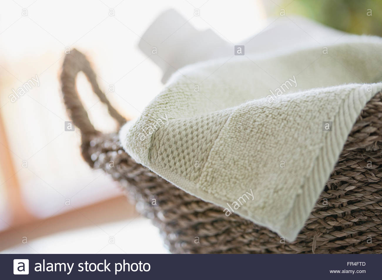 Closeup of clean towel in wicker basket Stock Photo Alamy