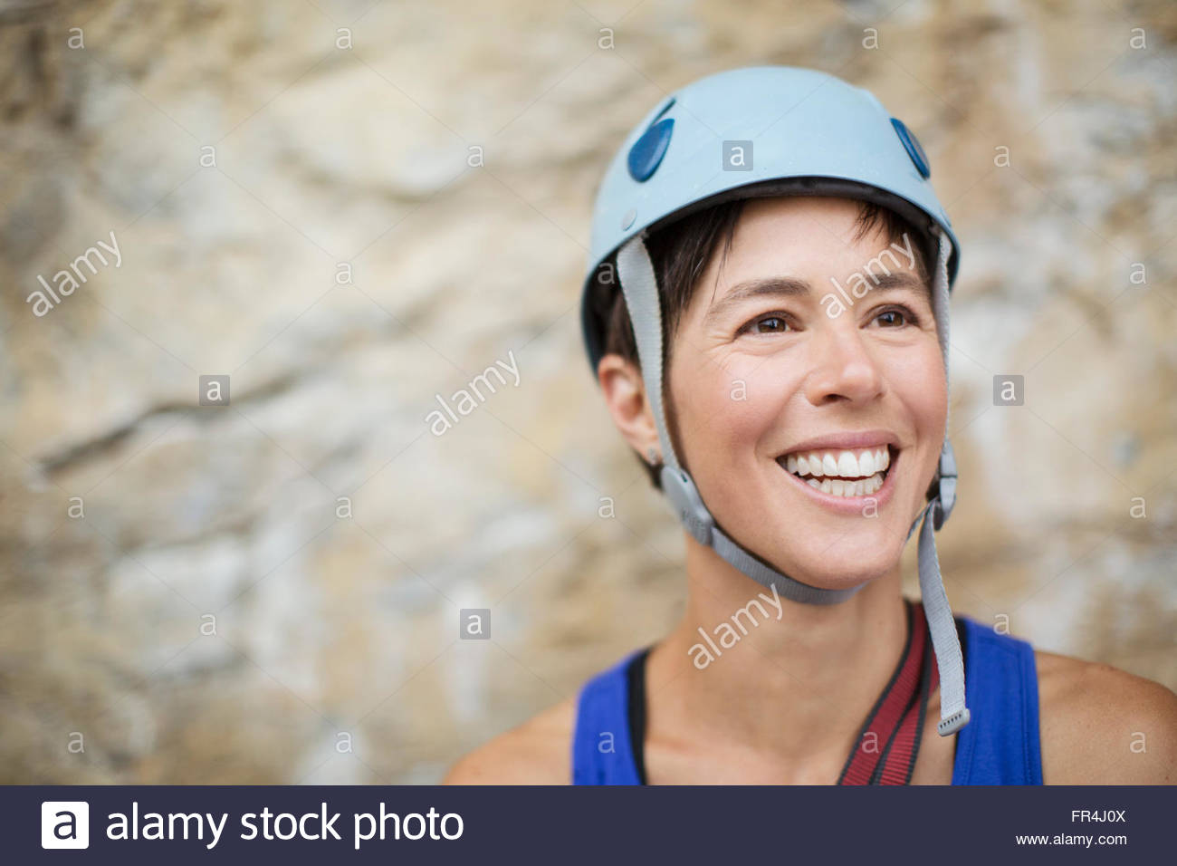 pretty, female rock climber wearing helmut Stock Photo Alamy