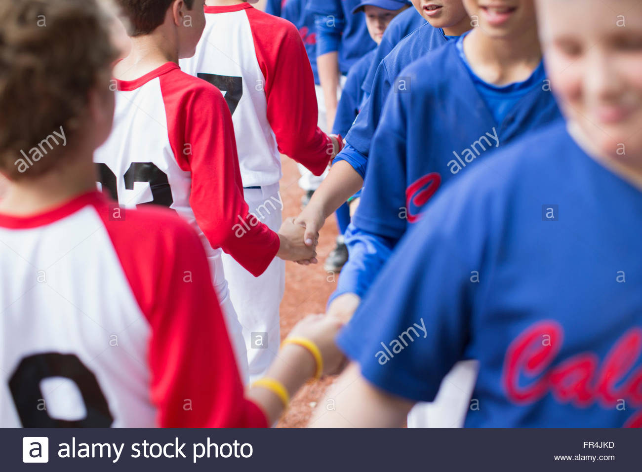 boys baseball teams shaking hands after game Stock Photo Alamy