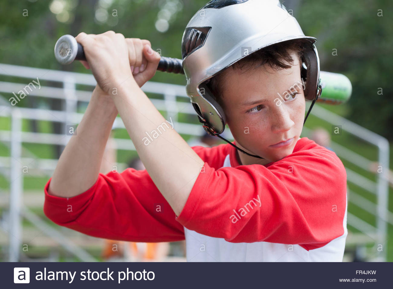 Twelve year old male baseball player ready to bat Stock Photo Alamy