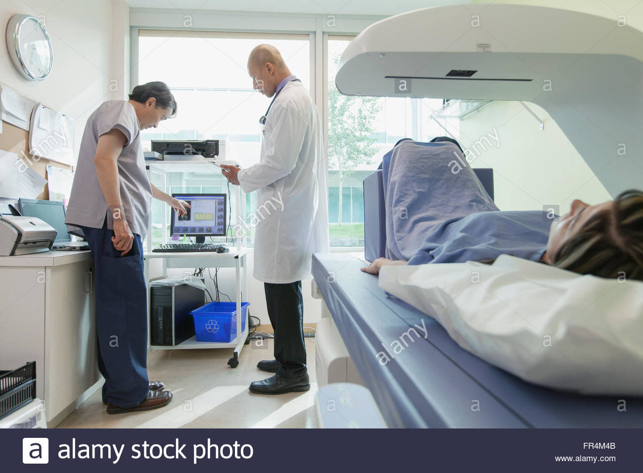 technician and doctor discussing test results Stock Photo