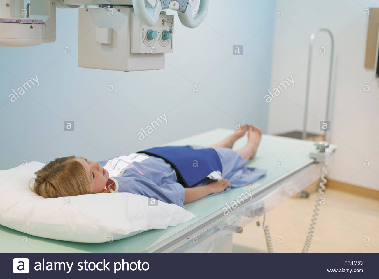 young girl positioned for xray Stock Photo Alamy
