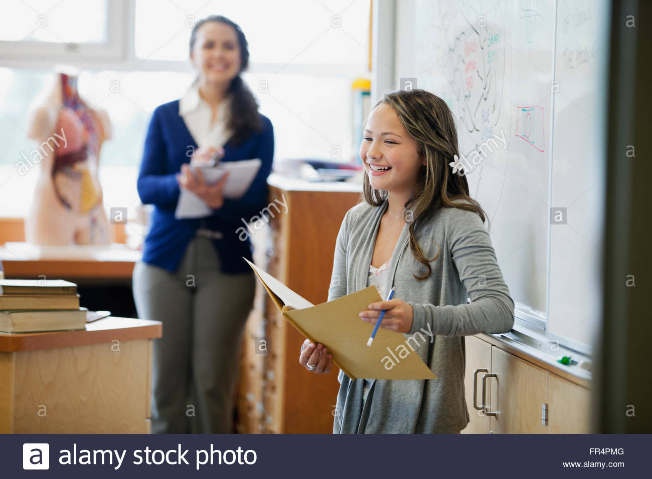 female, middle school student giving presentation Stock Photo