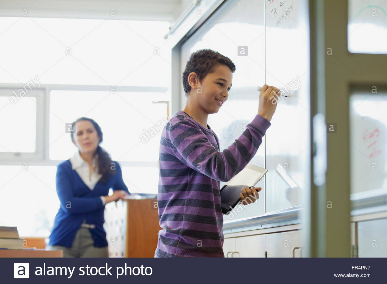 male middle school student presenting to class Stock Photo