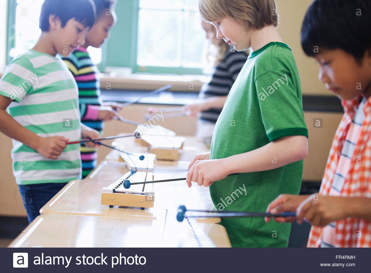 group of elementary students playing xylophones Stock Photo Alamy