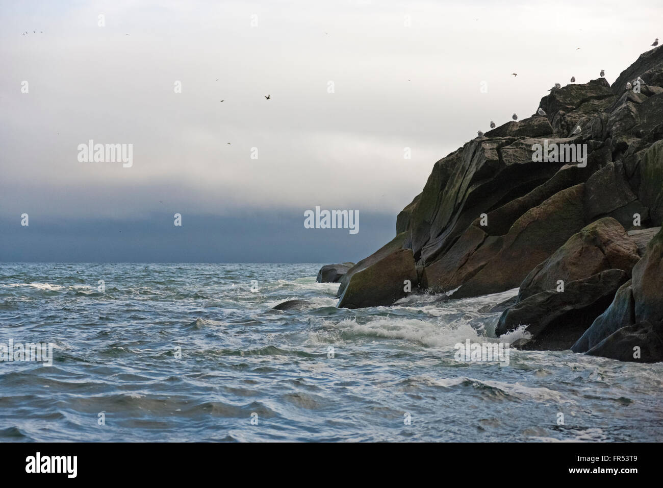 Rocky island with ocean, Cape Archen, Bering Sea, Russian Far East Stock Photo