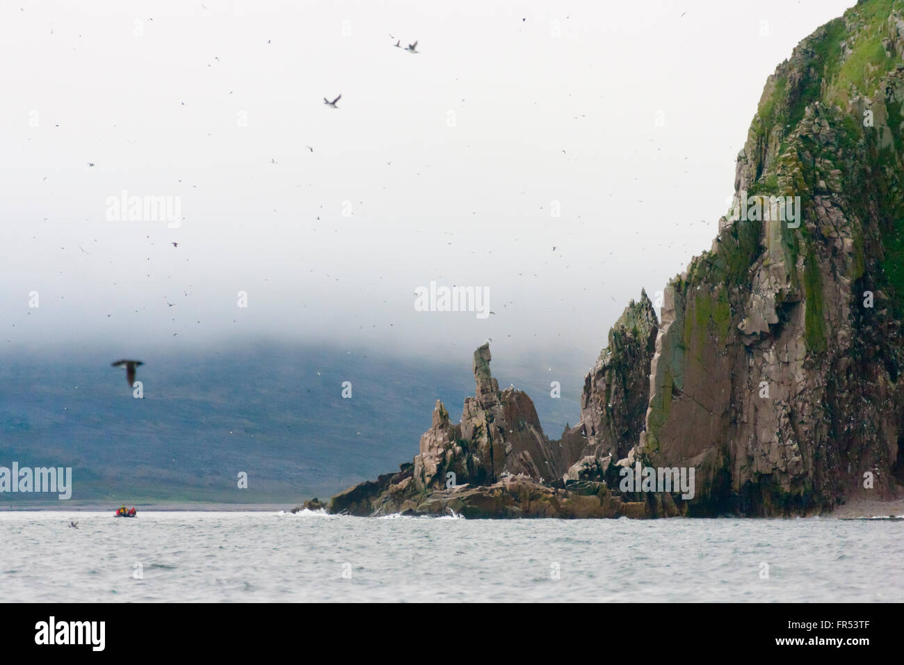 Rocky cliff with ocean, Cape Archen, Bering Sea, Russian Far East Stock Photo