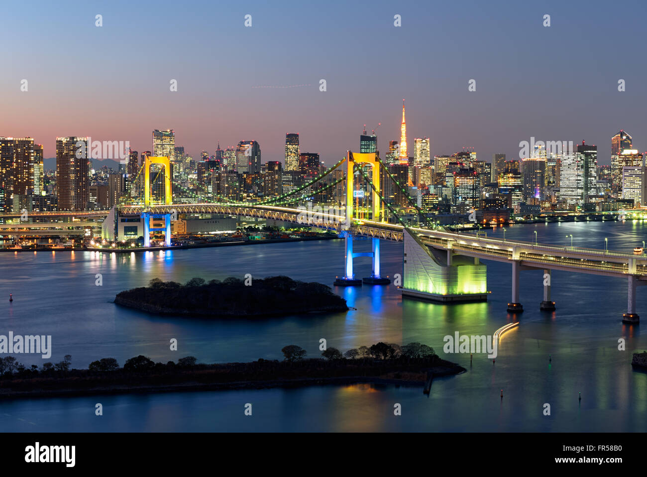 Tokyo, Japan -December 18, 2015: Tokyo Skyline at twilight at the Tokyo Bay,  Rainbow Bridge and Tokyo Tower are visible. Stock Photo