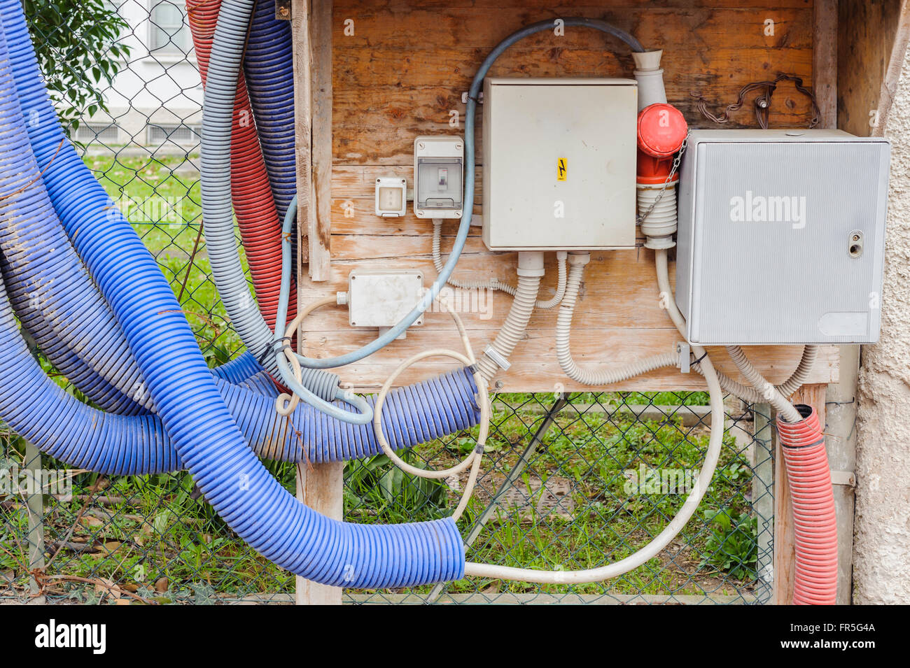 Temporary electrical panel and an electric meter for the work being done on the construction site. Stock Photo