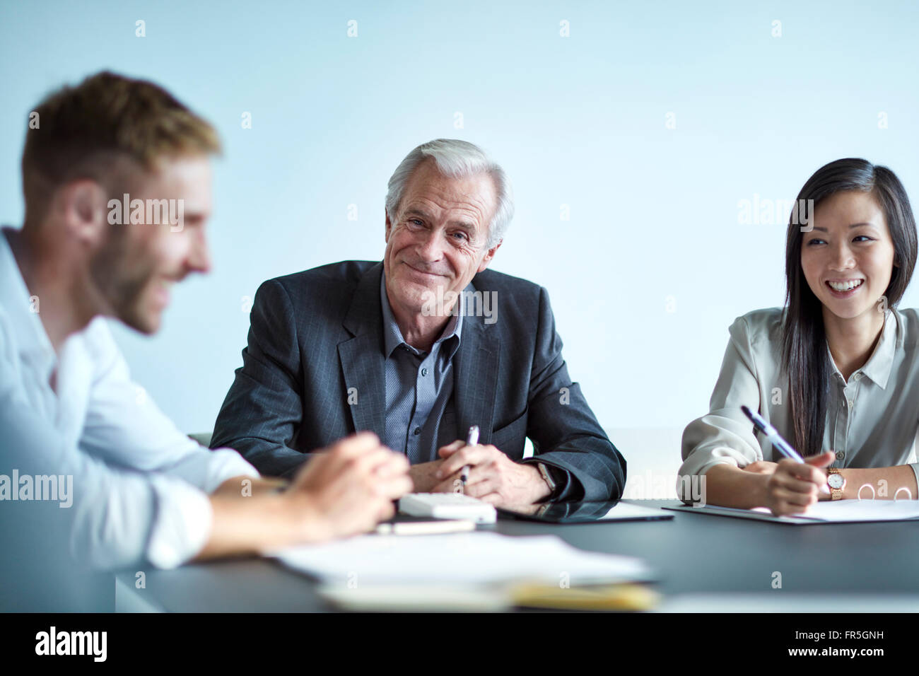 Portrait smiling senior businessman in meeting Stock Photo