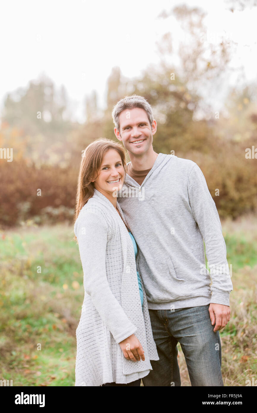 Portrait smiling couple in autumn park Stock Photo