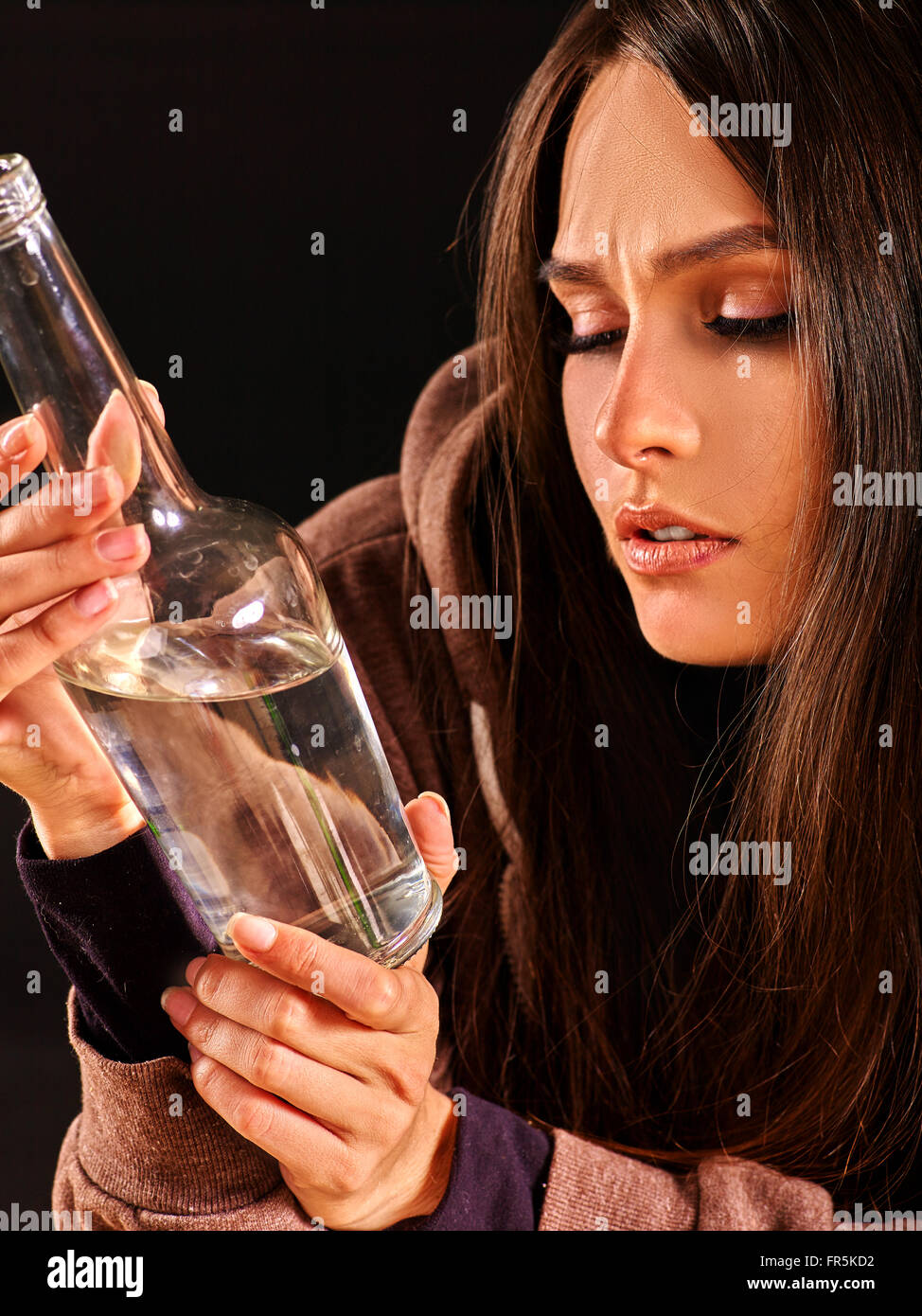 Drunk girl holding bottle of vodka Stock Photo Alamy