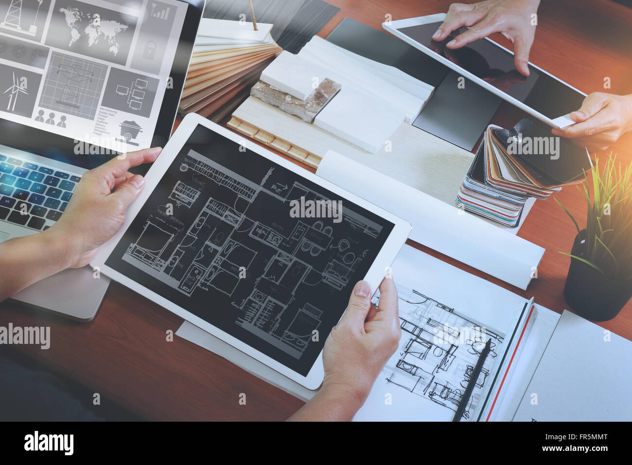 top view of two colleagues interior designers discussing data with ...