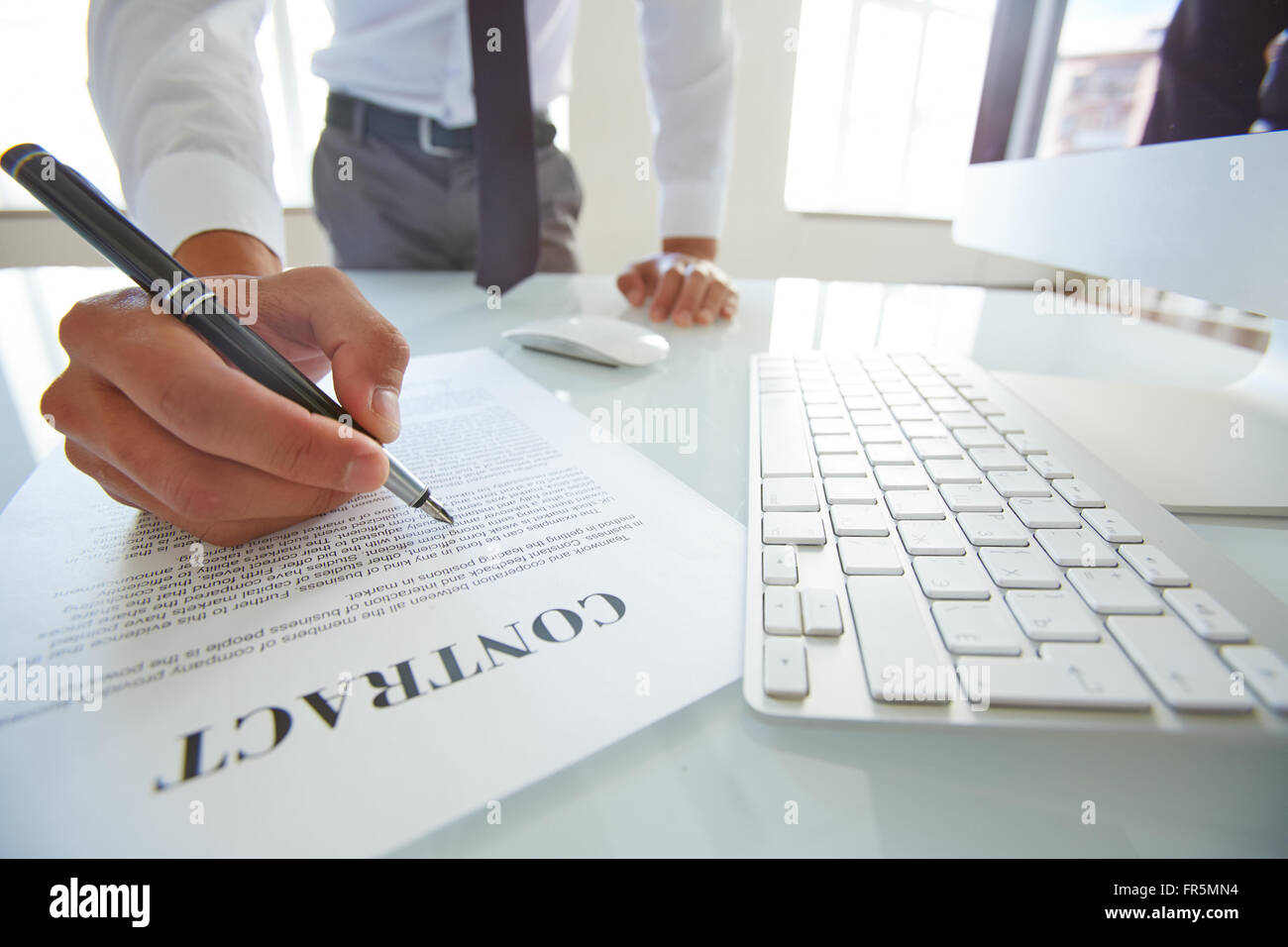 Close-up of businessman signing a contract Stock Photo - Alamy