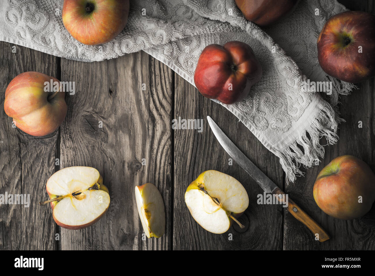 Red apples and apple halves on a wooden table horizontal Stock Photo