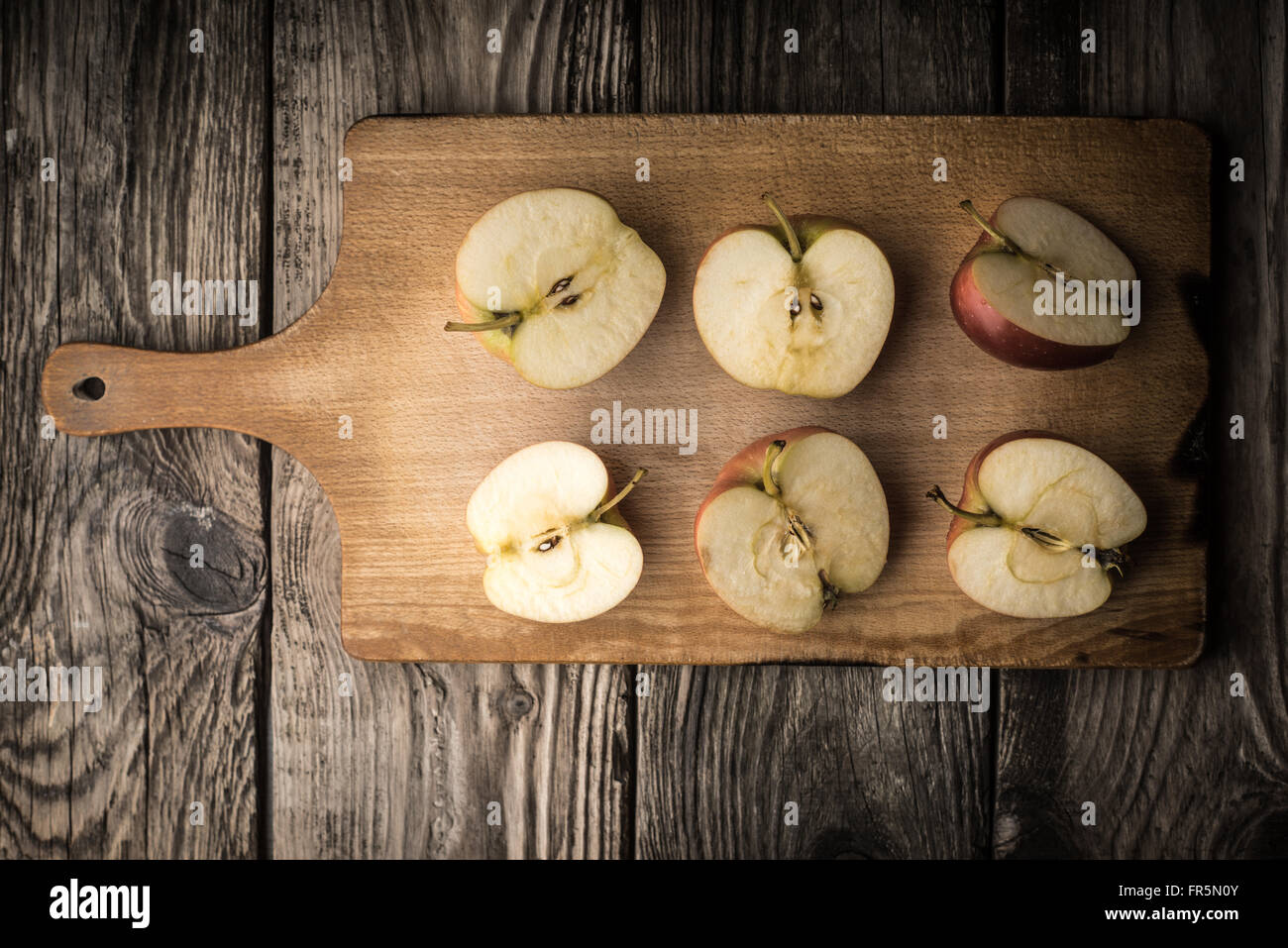 Apple Halves On A Cutting Board Horizontal Stock Photo Alamy