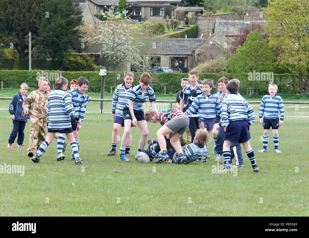 Boys playing rugby match Stock Photo