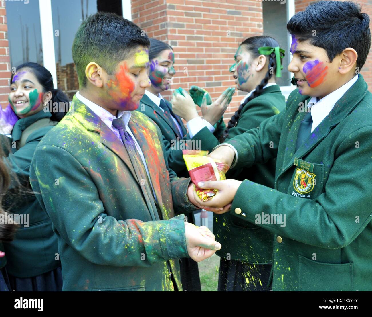 Patiala, India. 18th Mar, 2016. Students after their last exam playing Holi with Gulal ahead of Holi Festival at Village Reeth Kheri Sirhind road in India. © Rajesh Sachar/Pacific Press/Alamy Live News Stock Photo