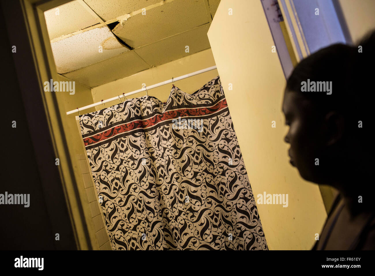 Memphis, TN, USA. 23rd Mar, 2015. Teresa Jeans' shows off the bathroom ceiling in her apartment within the Warren Apartment complex. Jeans unit has multiple areas of water damage due to leaking pipes, holes in the walls from rats and other pests, uncovered outlets and many other unresolved maintenance issues. © (Brad VestThe Commercial AppealThe Commercial Appeal/ZUMA Wire/Alamy Live News Stock Photo