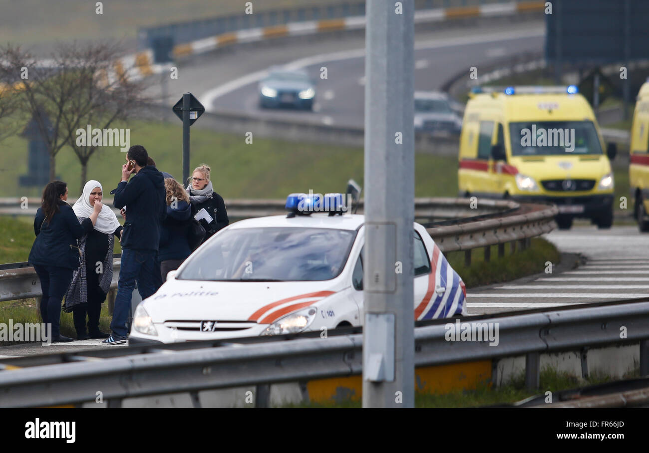 Brussels, Belgium. 22nd Mar, 2016. People are evacuated from Brussels airport in Brussels, Belgium, on March 22, 2016. At least 13 people were reportedly dead after explosions at Brussels airport and a metro station on Tuesday. Credit:  Ye Pingfan/Xinhua/Alamy Live News Stock Photo