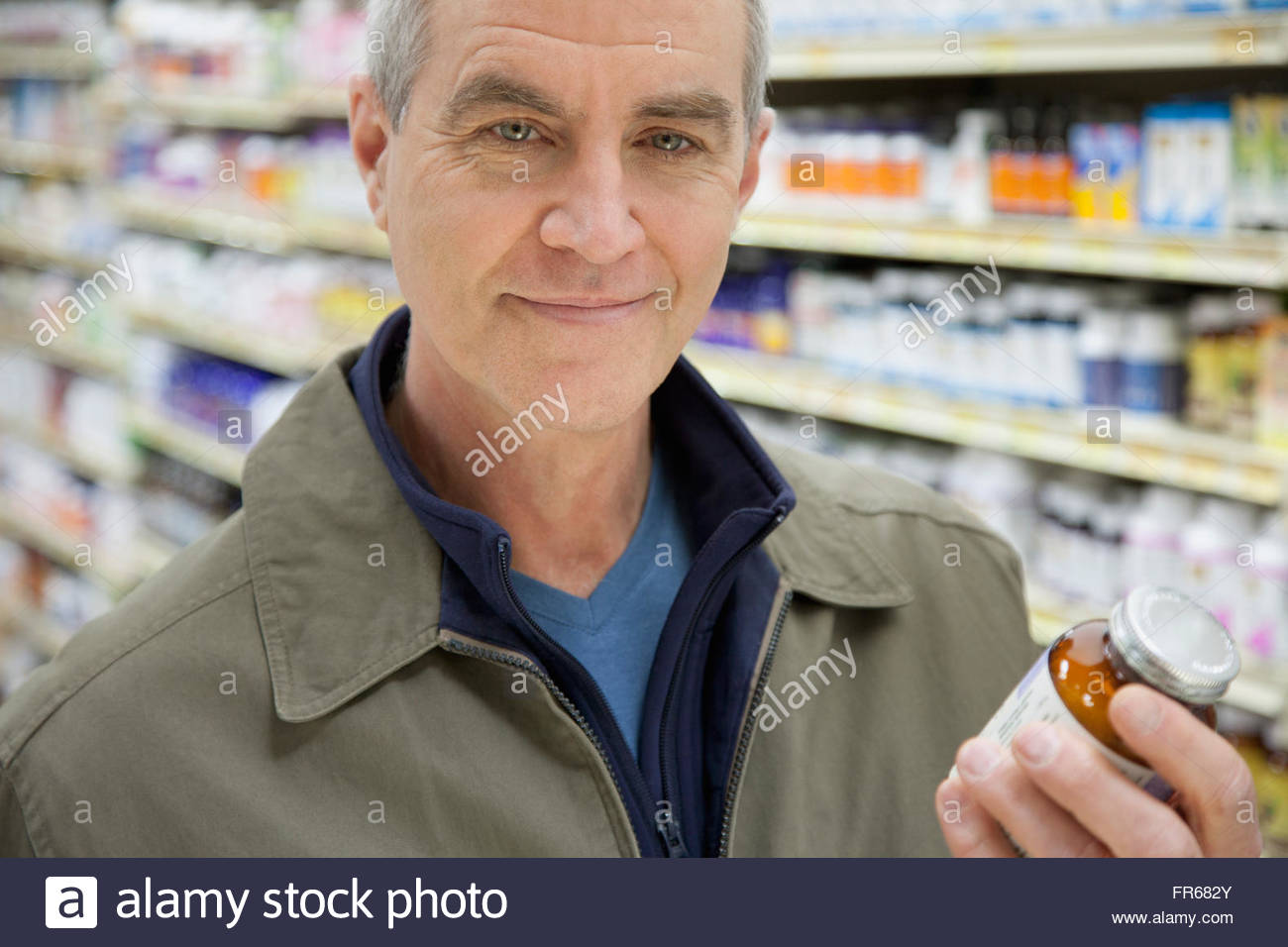 man-reading-the-labels-at-a-drug-store-stock-photo-alamy