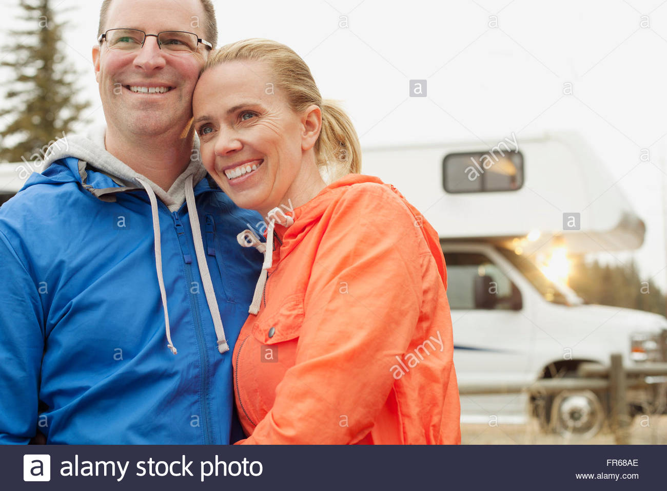 mid-adult couple with motor home Stock Photo