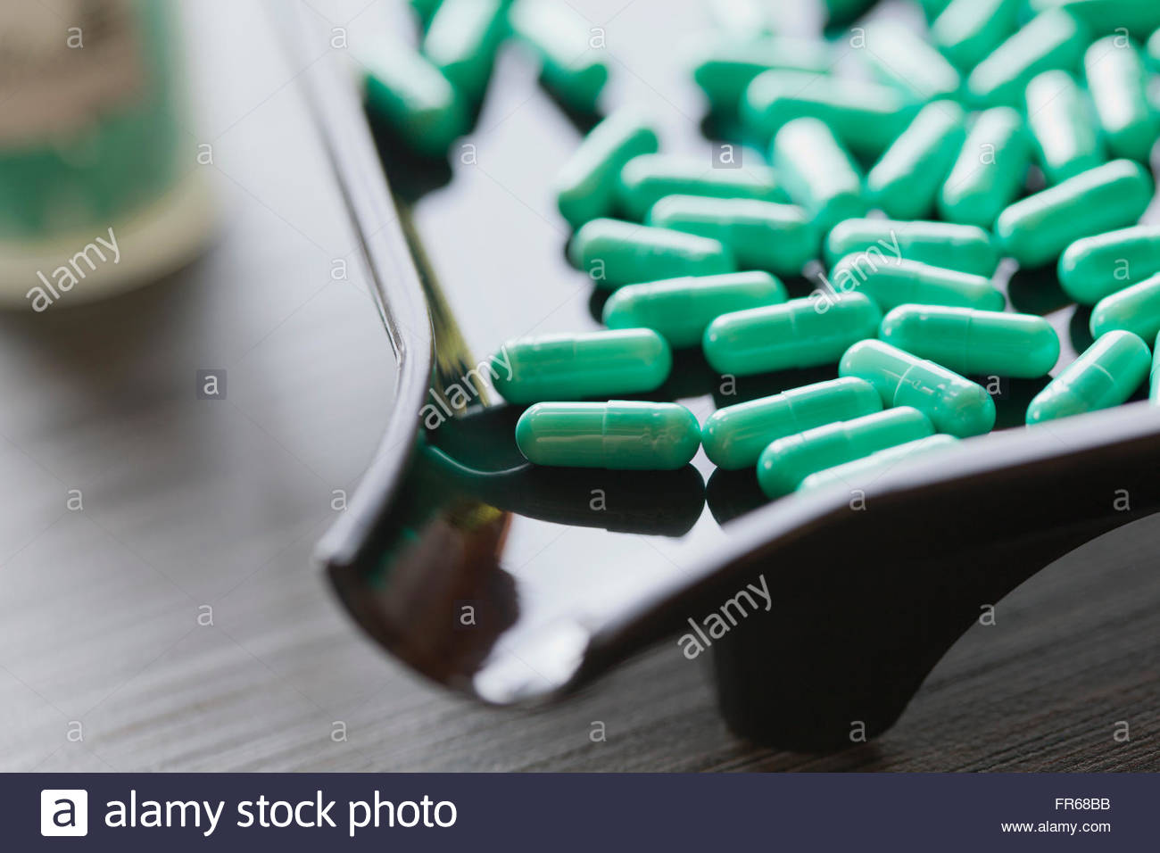 closeup of capsules in dispensing tray Stock Photo