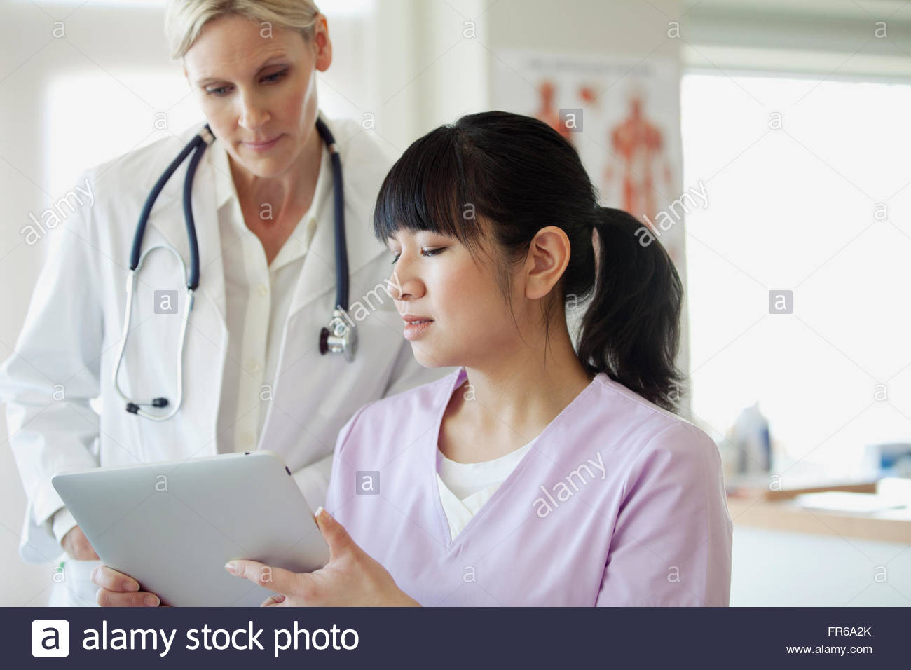 doctor and assistant consulting Stock Photo