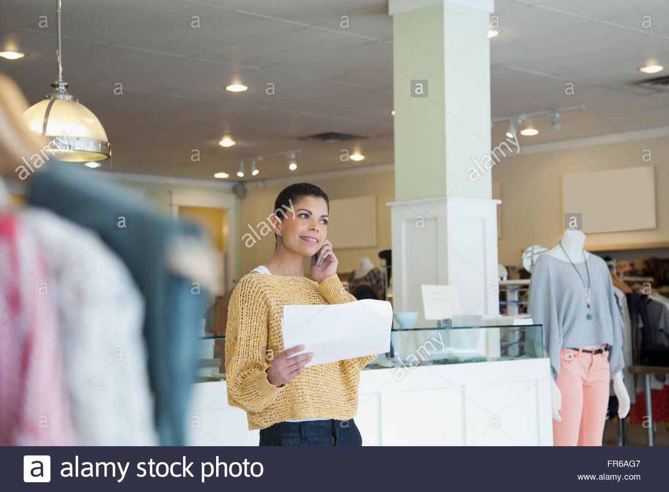 store owner on a phone call Stock Photo Alamy
