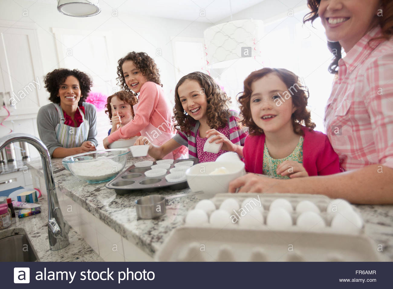 moms and daughters baking in the kitchen Stock Photo Alamy