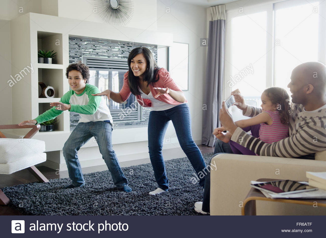 mom and son playing motionsensing video game Stock Photo Alamy