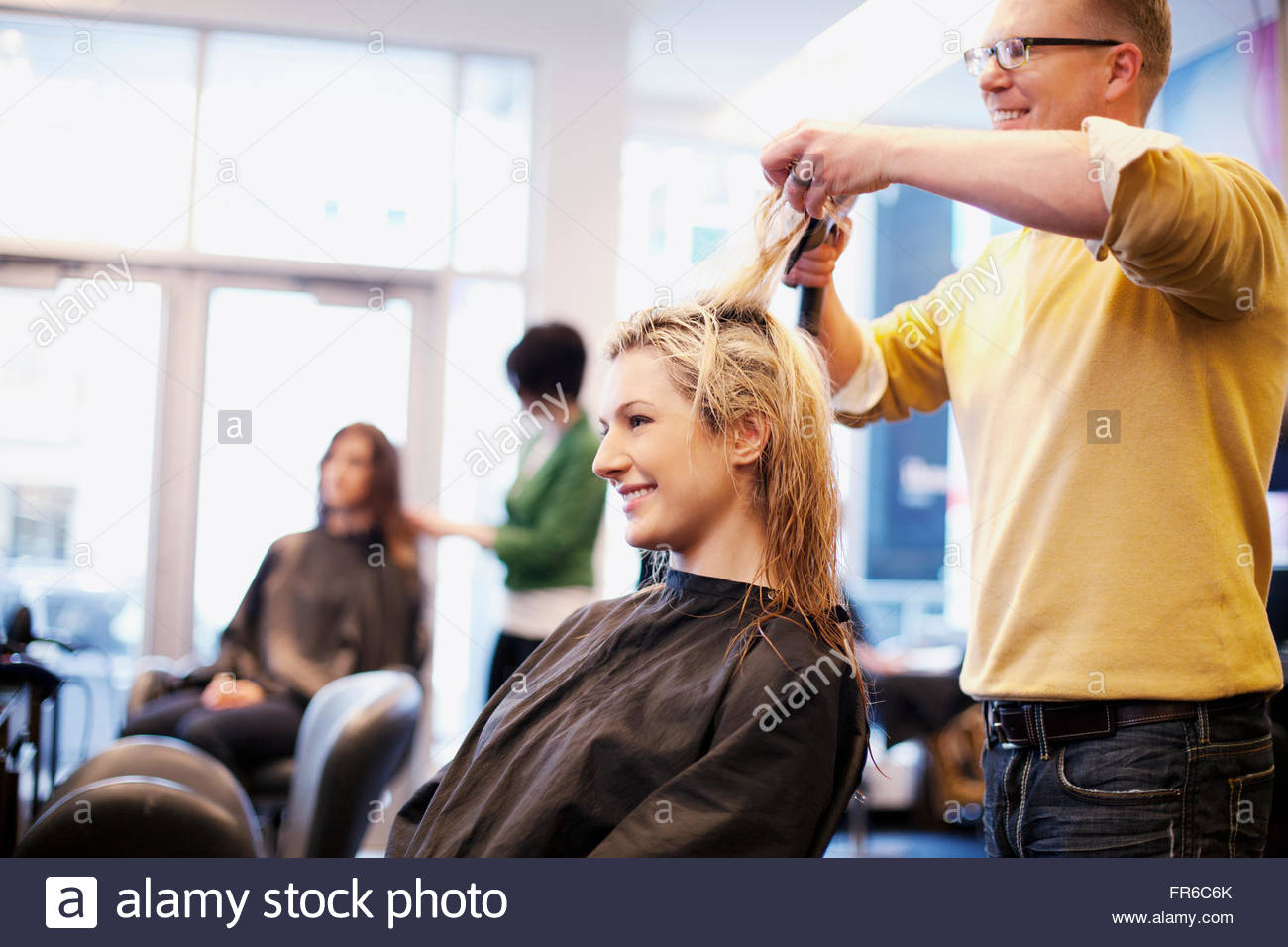 hairstylists working in salon Stock Photo Alamy