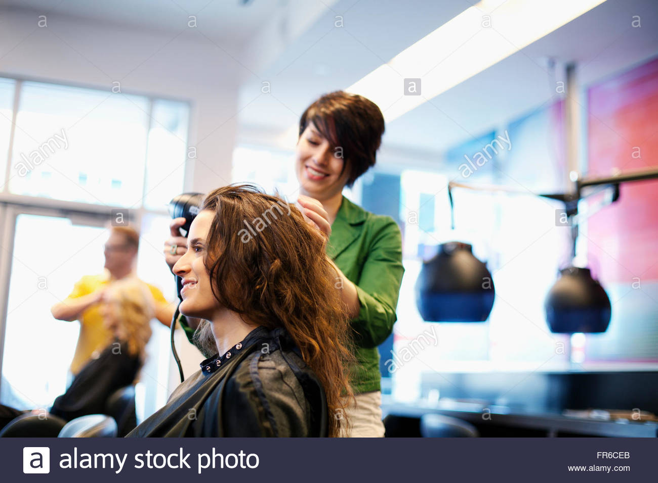 hairstylists working in salon Stock Photo Alamy