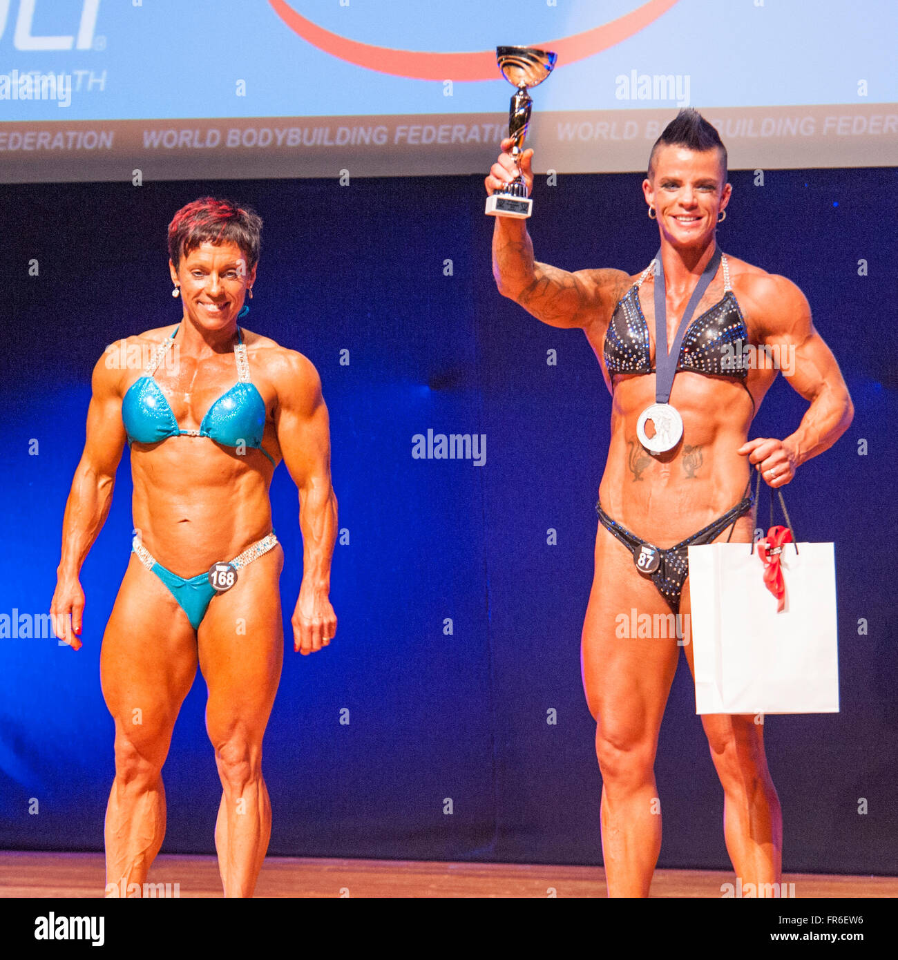 MAASTRICHT, THE NETHERLANDS - OCTOBER 25, 2015: Female bodybuilders Michèle Steenhaut and Cinneke Limpens celebrate victory Stock Photo