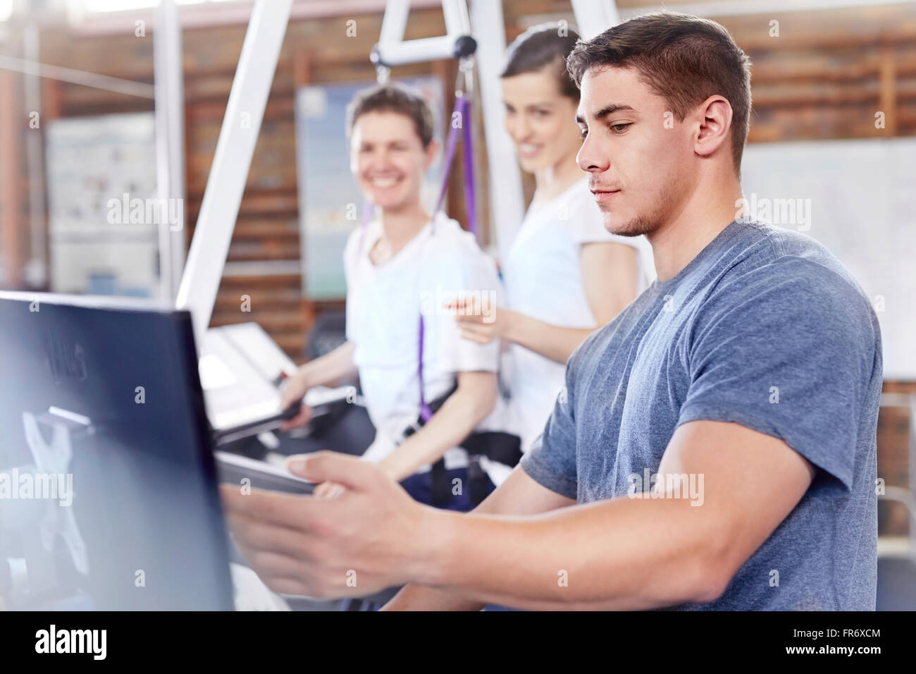 Physical therapists working at computer Stock Photo