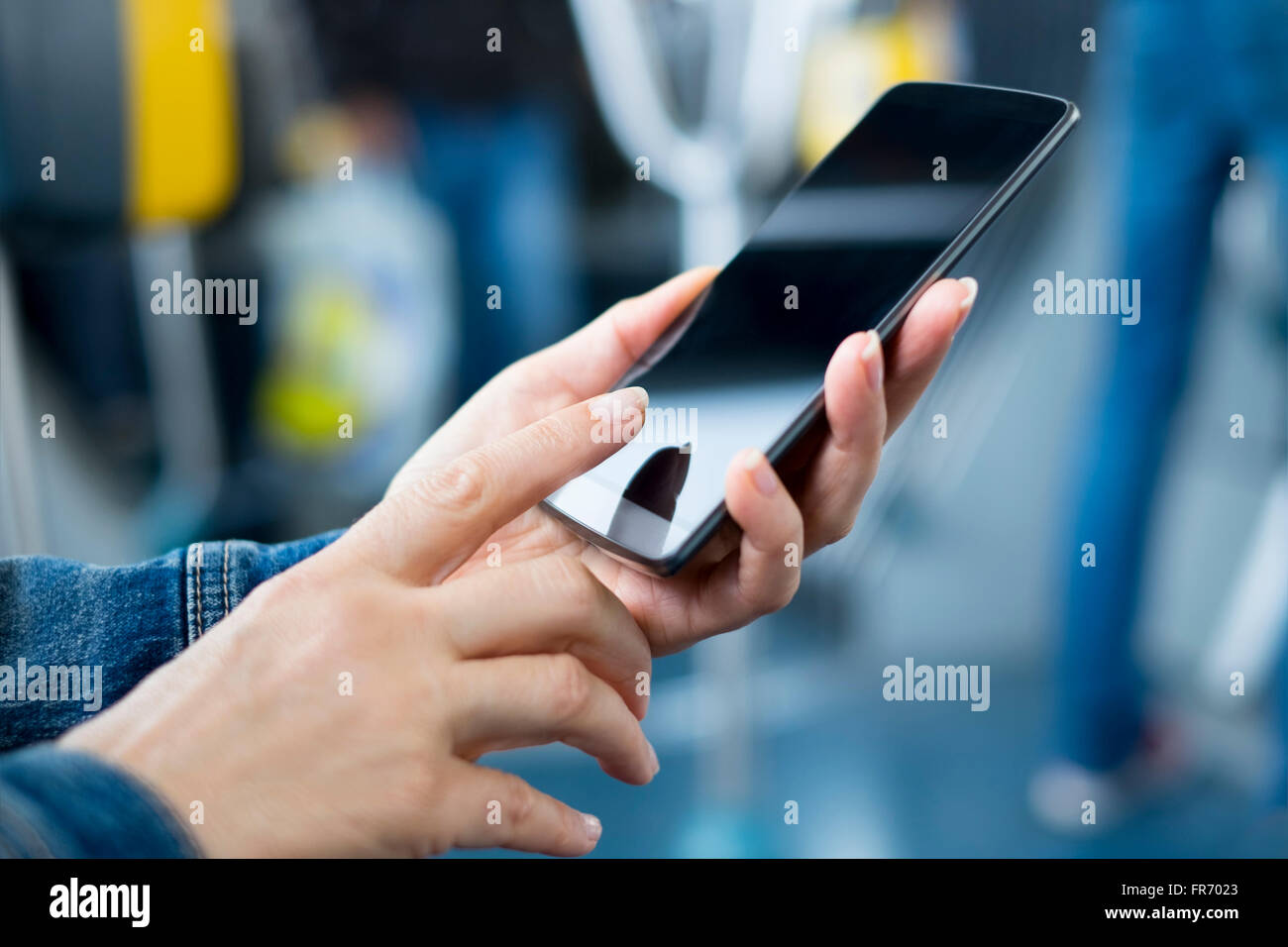 Woman using smartphone on bus. Sms, message, app Stock Photo