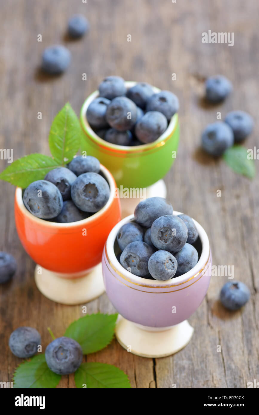 Freshly picked blueberries on wooden table Stock Photo