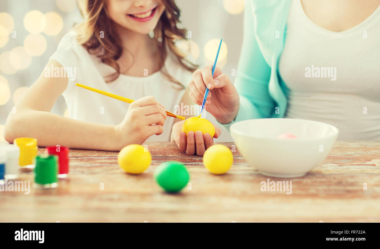 close up of family coloring easter eggs Stock Photo