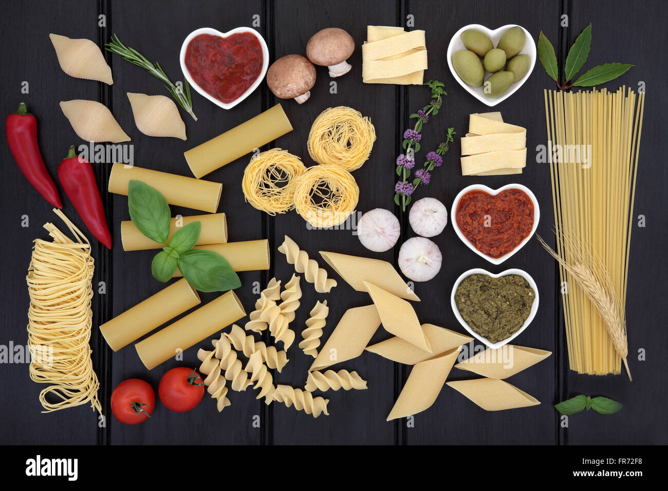 Italian health food ingredient selection over dark wood background. Stock Photo