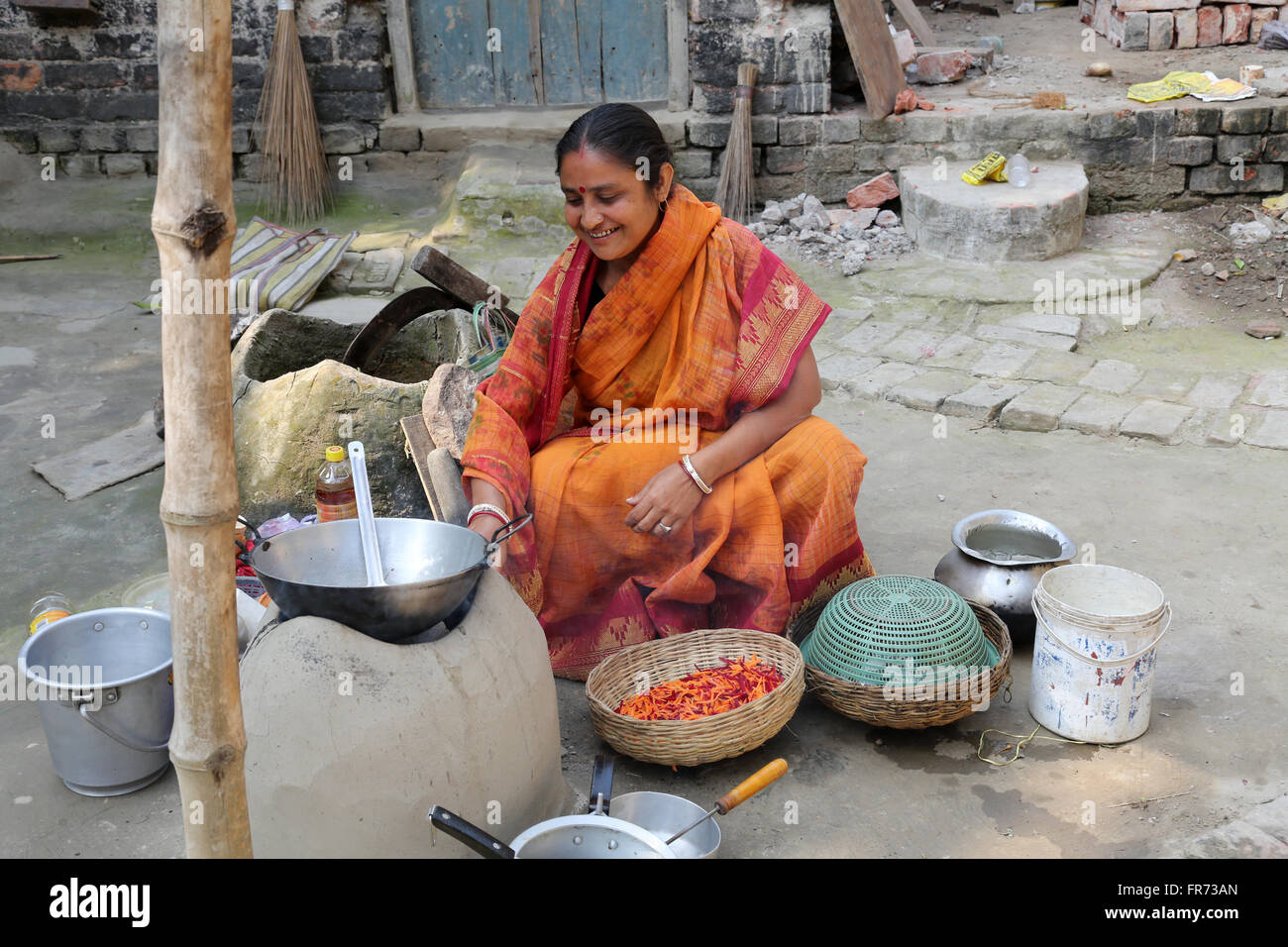 Traditional way of making food on open fire in old kitchen in a village, Kumrokhali, West Bengal, India Stock Photo