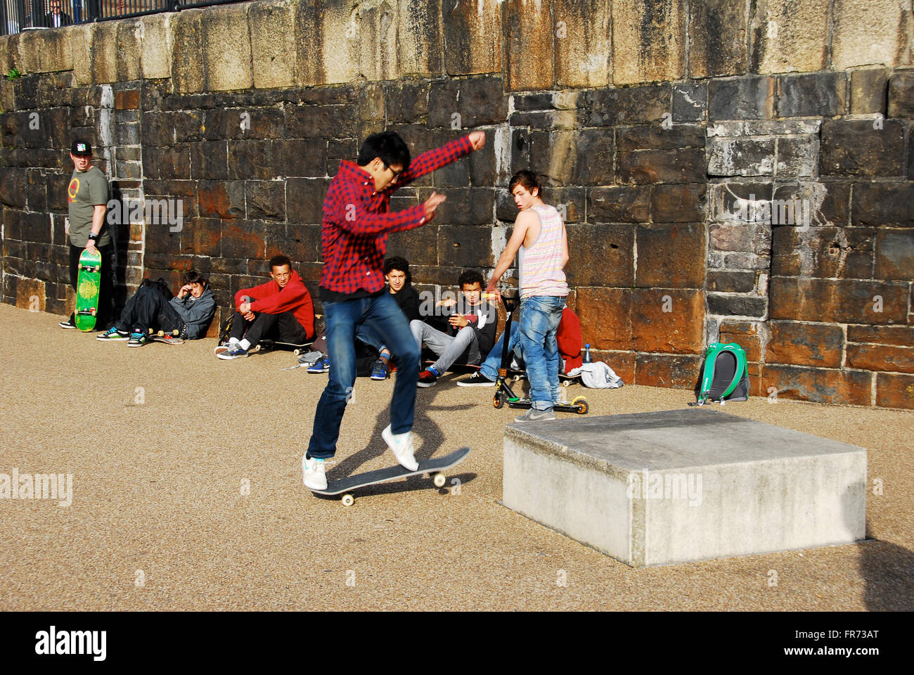 Chinese boy skateboarding Stock Photo