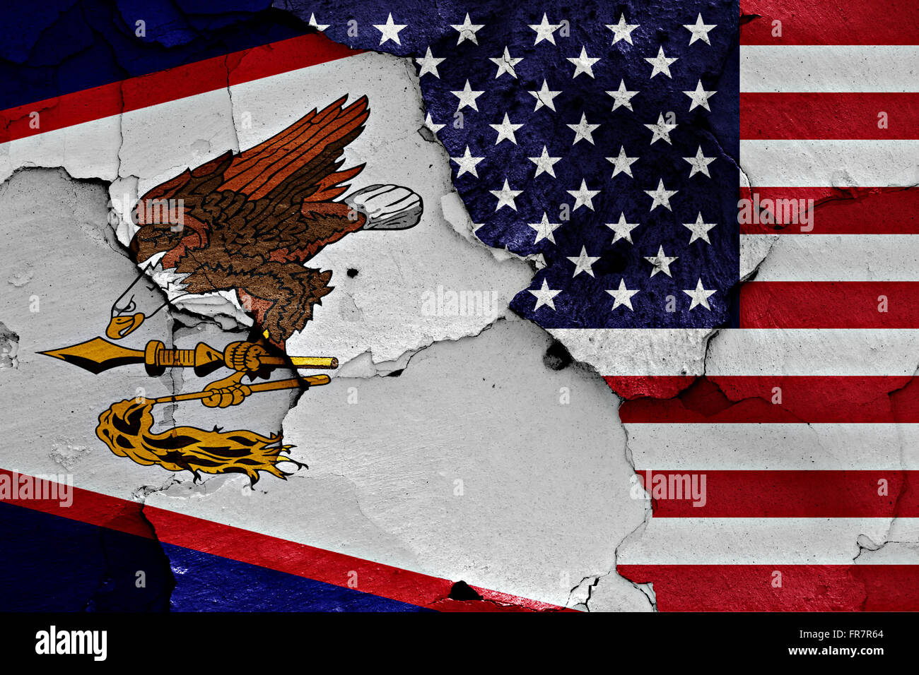 flags of American Samoa and USA painted on cracked wall Stock Photo