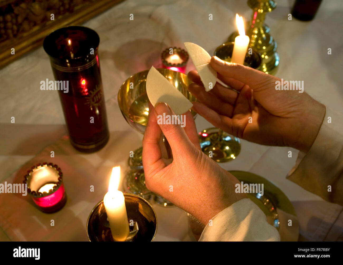 Anglo Catholic breaking communion wafers Stock Photo Alamy