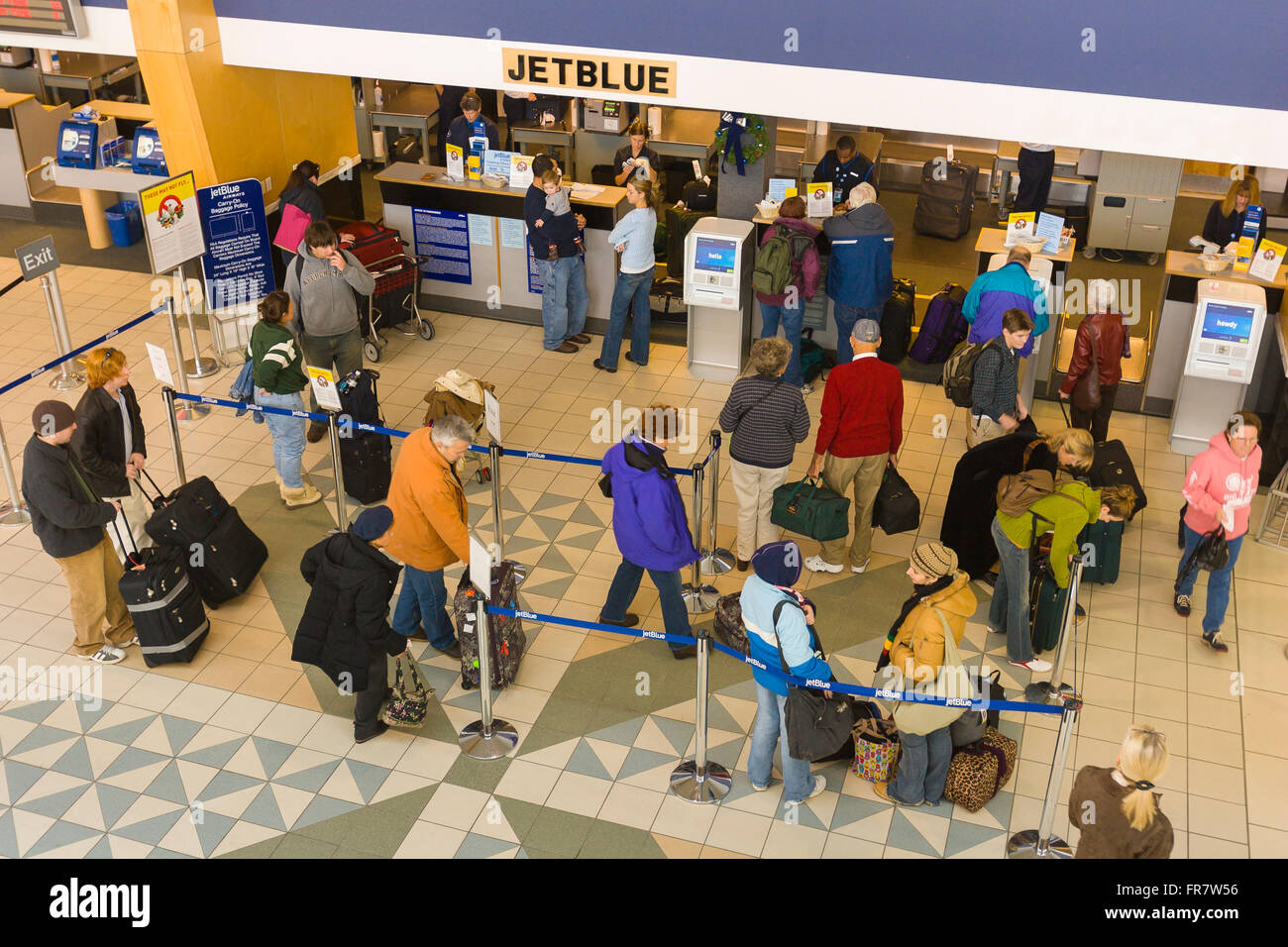 BURLINGTON, VERMONT, USA Passengers at ticket counter for JetBlue