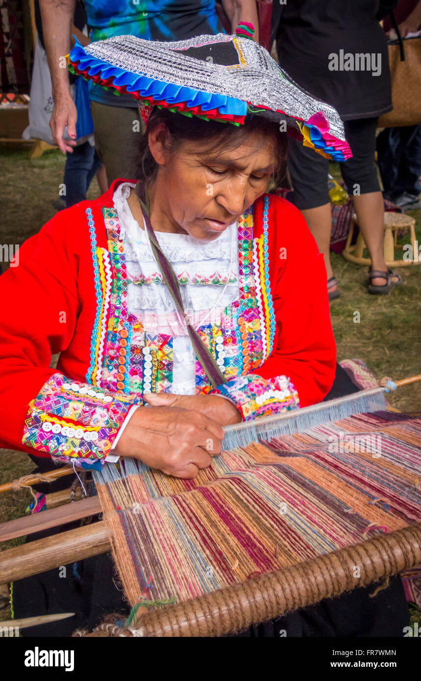 WASHINGTON, DC, USA - Woman demonstrates weaving by hand with backstrap loom (awana), 2015 Smithsonian Folk Life Festival Stock Photo