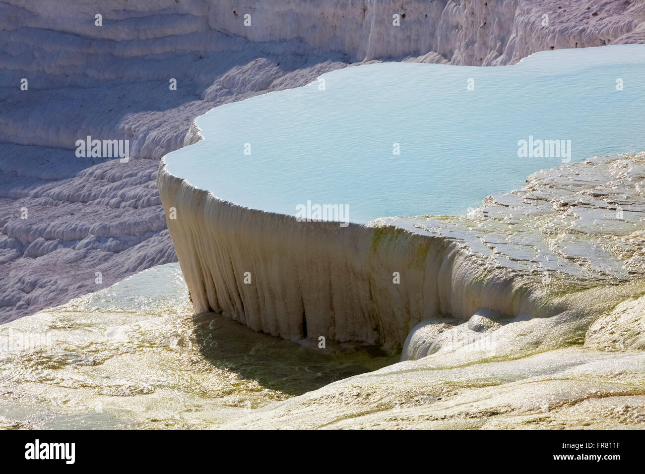 Hot springs and travertines, terraces of carbonate minerals left by the flowing water; Pamukkale, Turkey Stock Photo