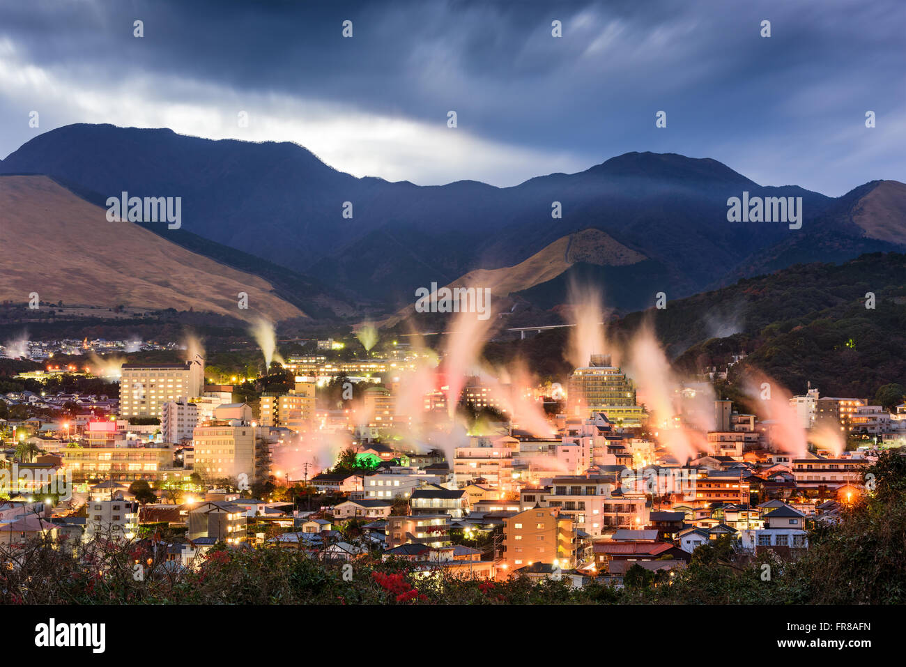 Beppu, Japan cityscape with hot spring bath houses with rising steam. Stock Photo