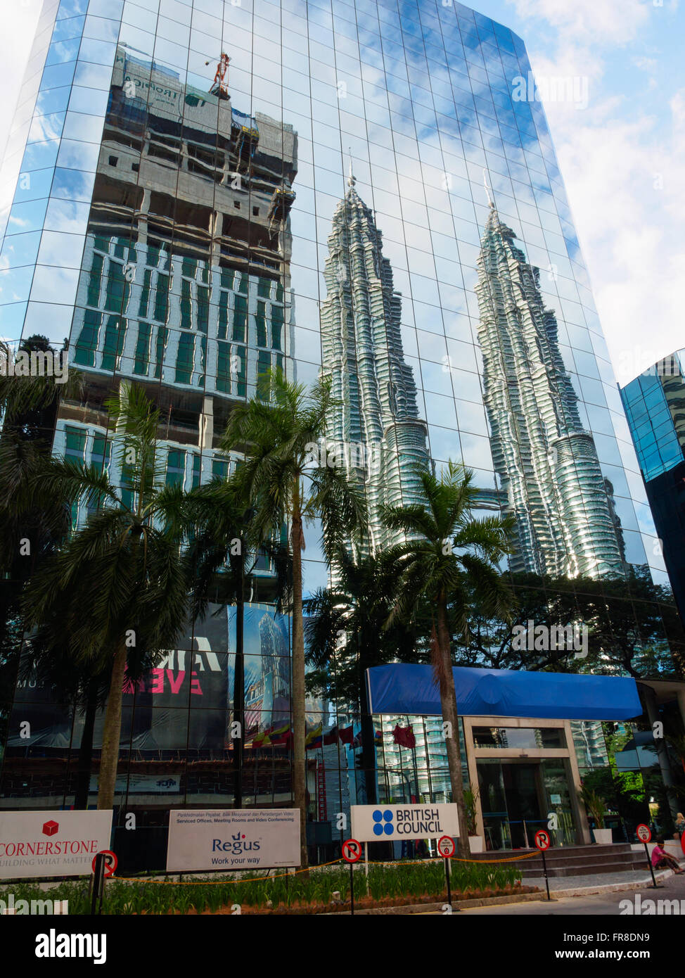 Reflection of the Petronas Twin Towers in a nearby sky scraper in Kuala Lumpur, Malaysia Stock Photo