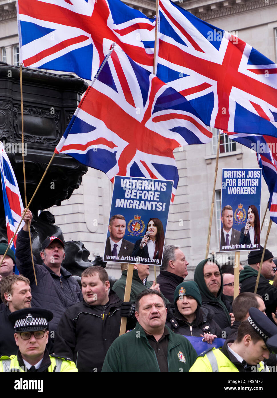 Britain First, a right wing racist group gather and try to disrupt the Stand Up against Racism March through London Stock Photo